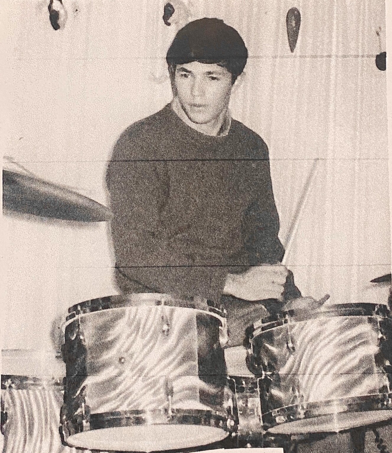 Jacques Aknin playing drums in a family-supplied photograph